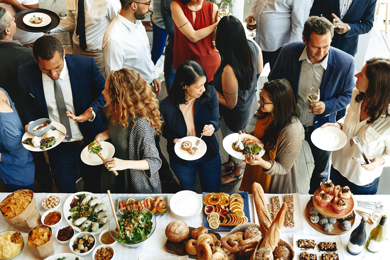 People at a reception eating and talking