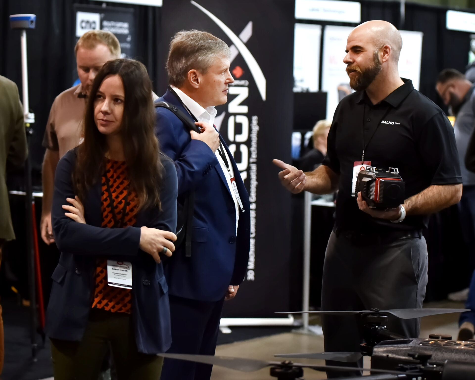 Attendees engage with exhibits on the trade show floor at GoGeomatics Expo 2025