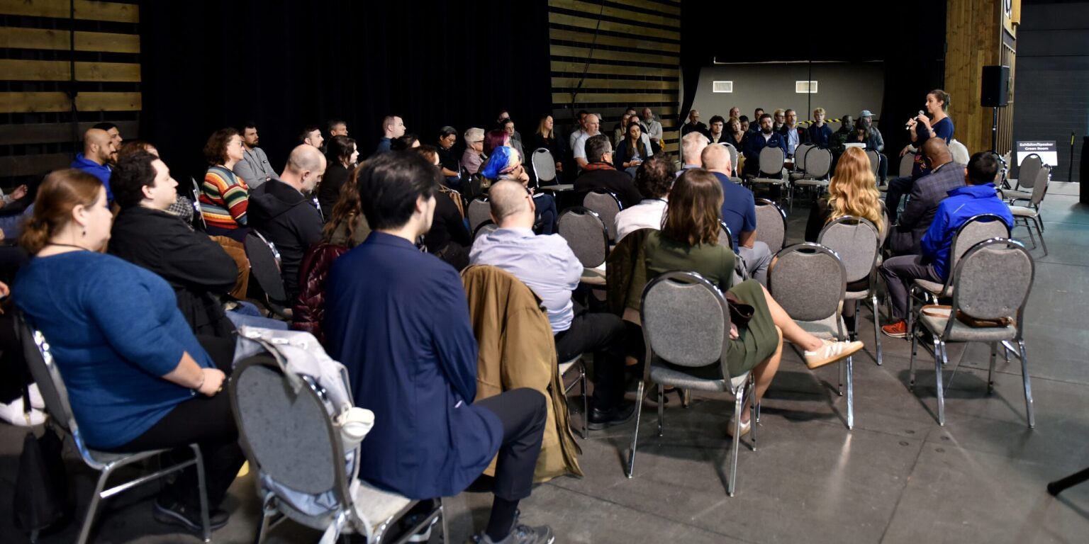 Delegates fill the room in a wide seated audience at the Canadian Geomatics and Geospatial Advisory Forum